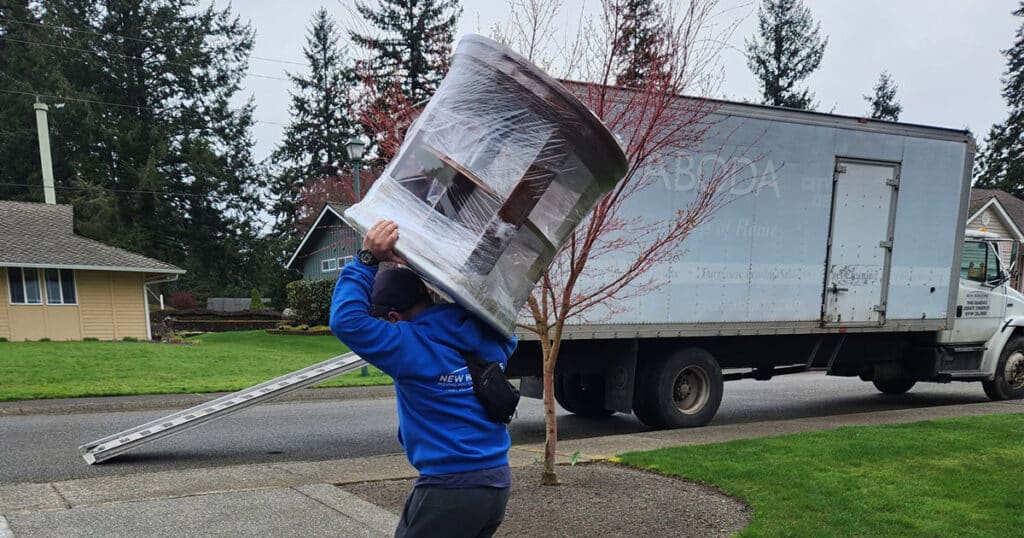 Tacoma movers moving furniture into truck