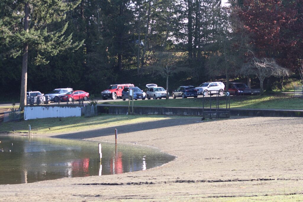 Steel Lake Park in Federal Way, Washington, with calm lake water in the foreground